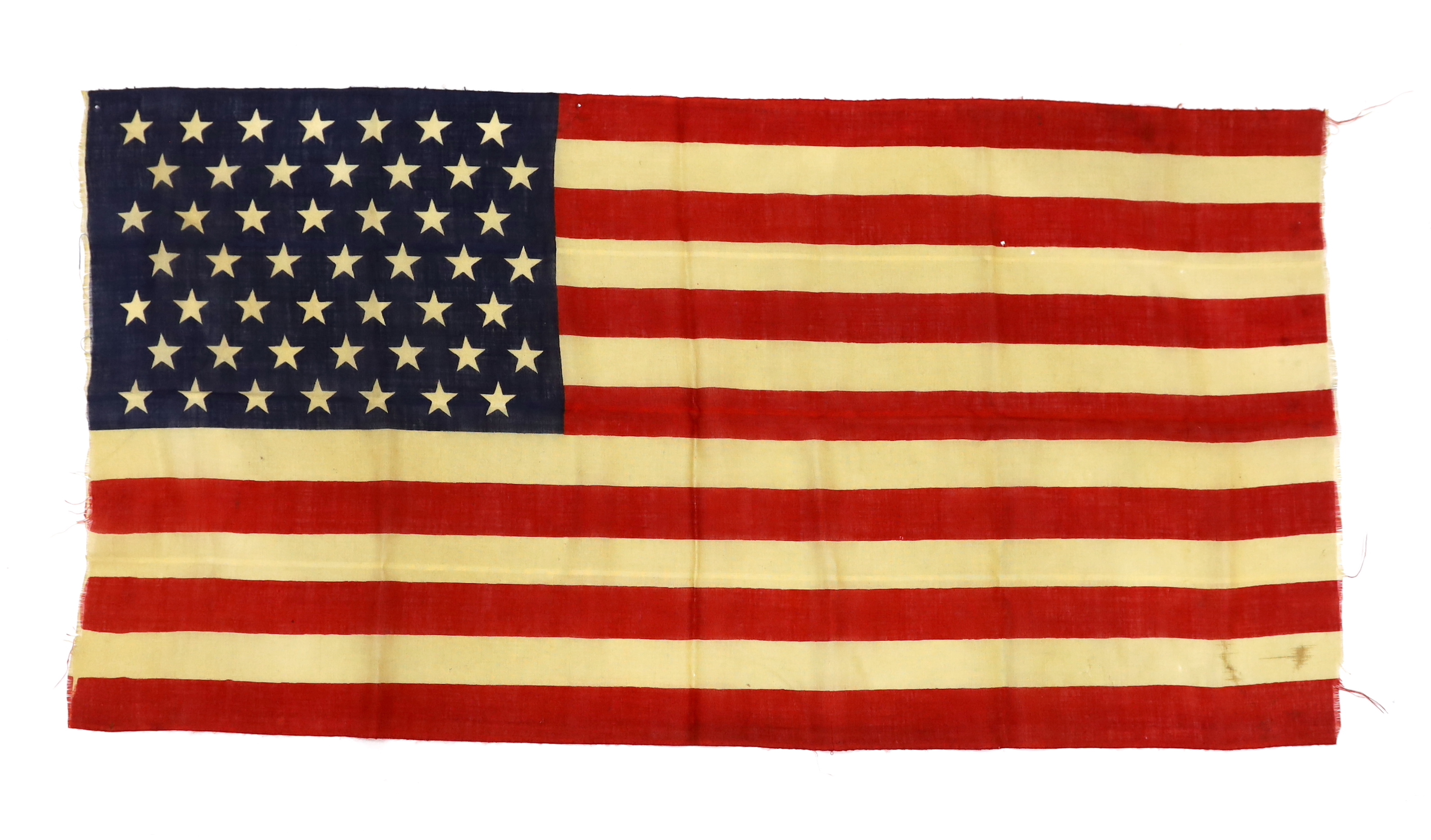 A 1959 USA flag, ‘Stars and Stripes’ printed on light open woven material, forty-nine stars, seven red stripes and six white stripes, 70 x 138cm